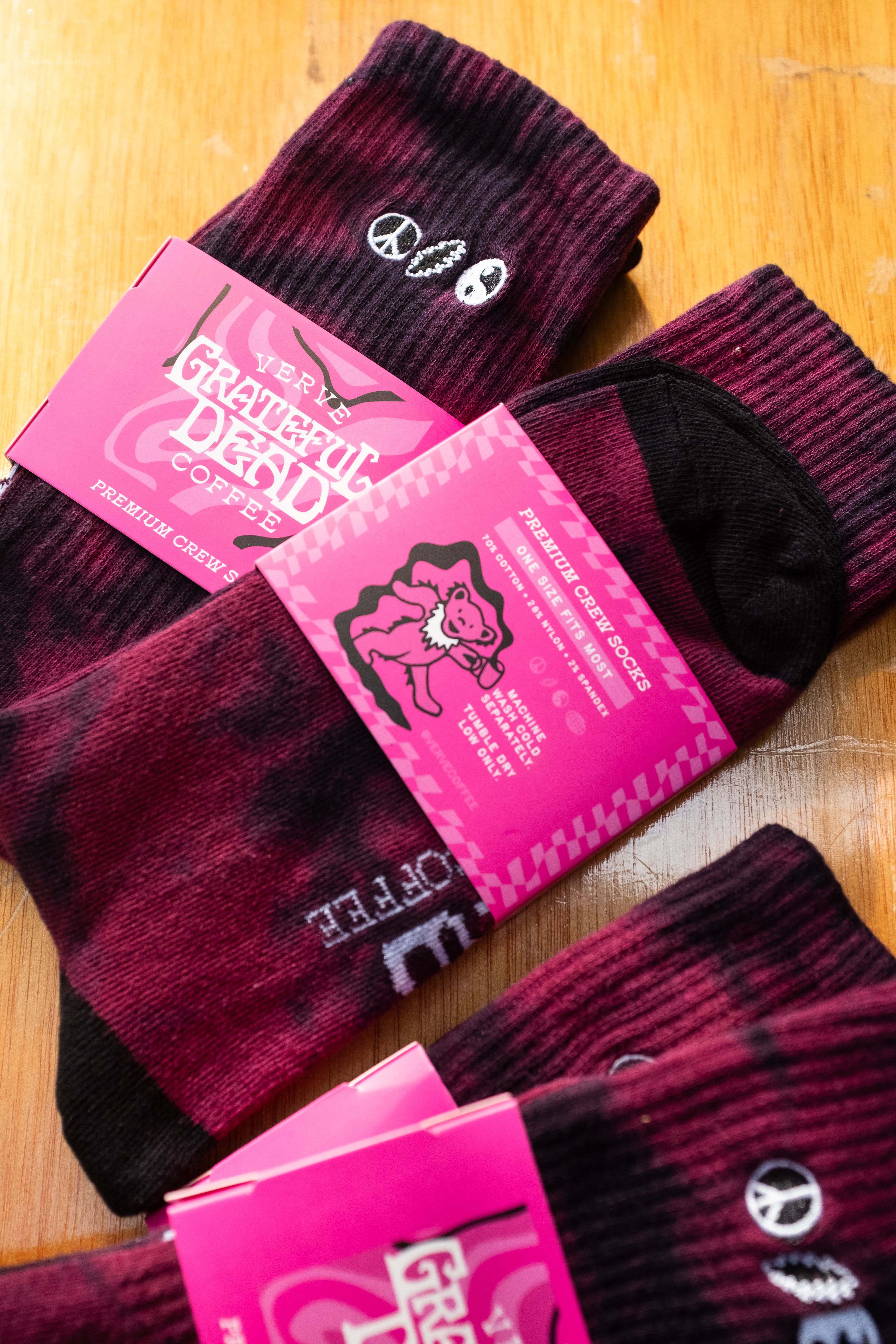 Greatful Dead branded crew socks in bright pink retail packaging
