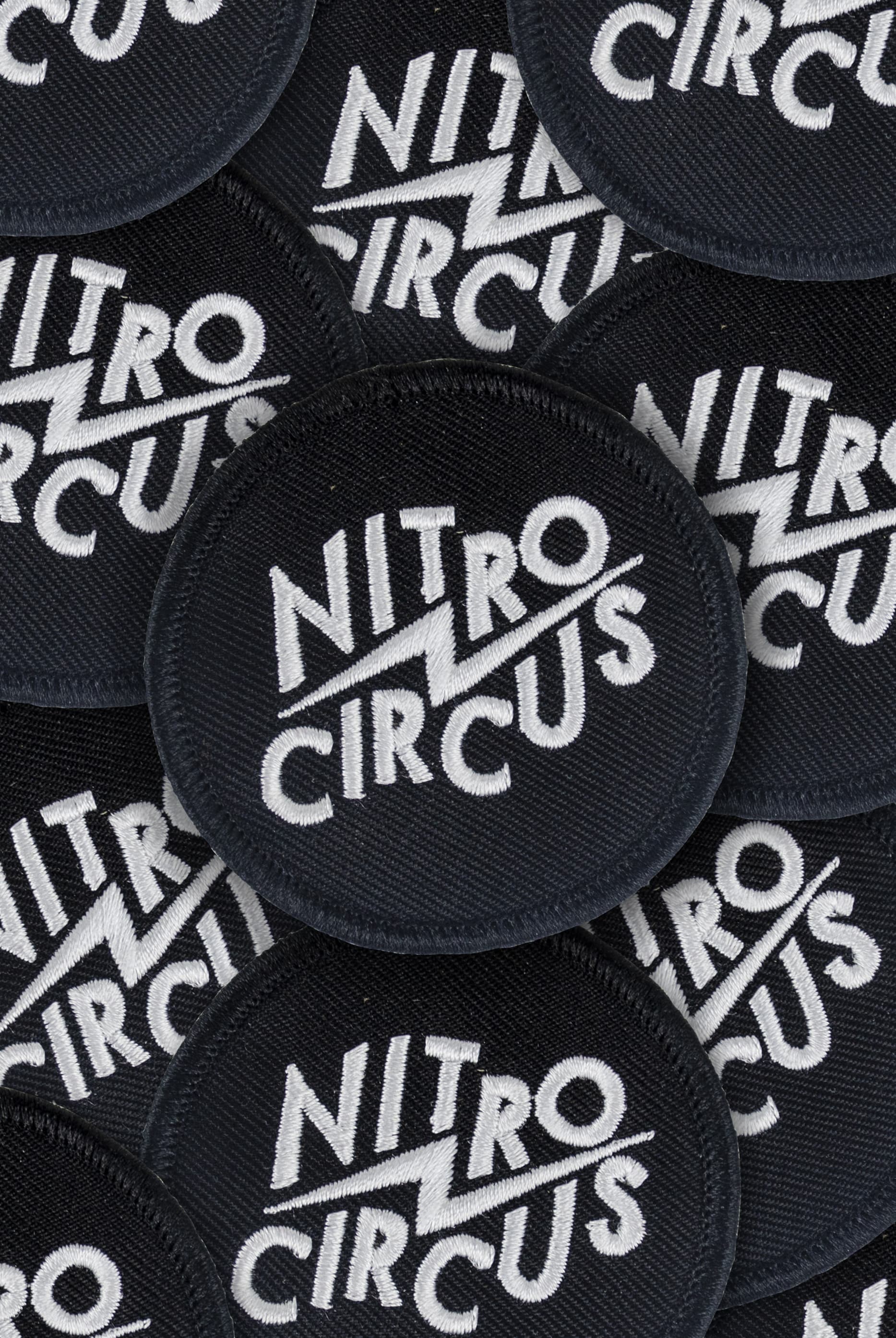 Nitro Circus embroidered black patches arranged in a close-up grid