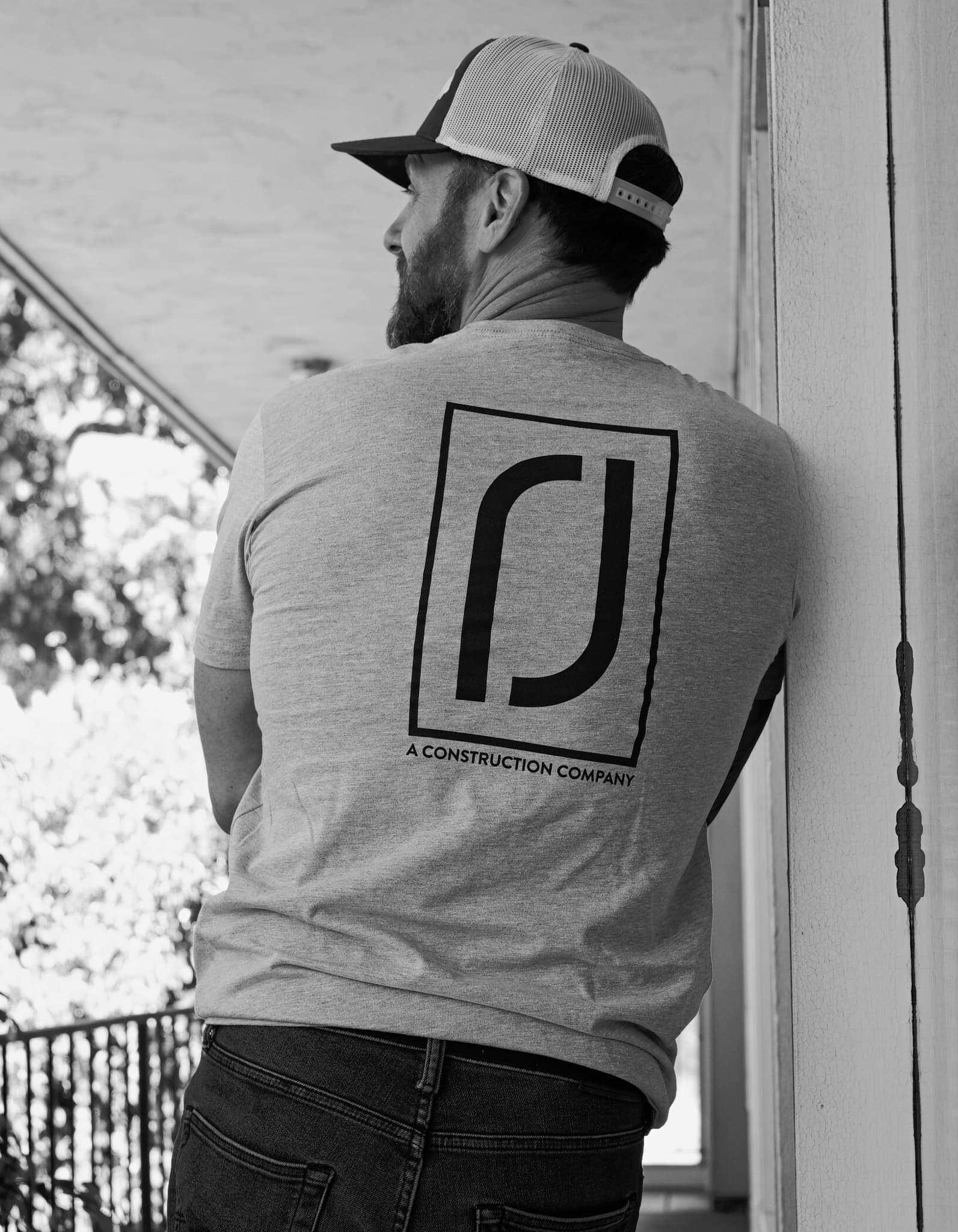 Construction company back-print tee shown as a custom construction apparel example