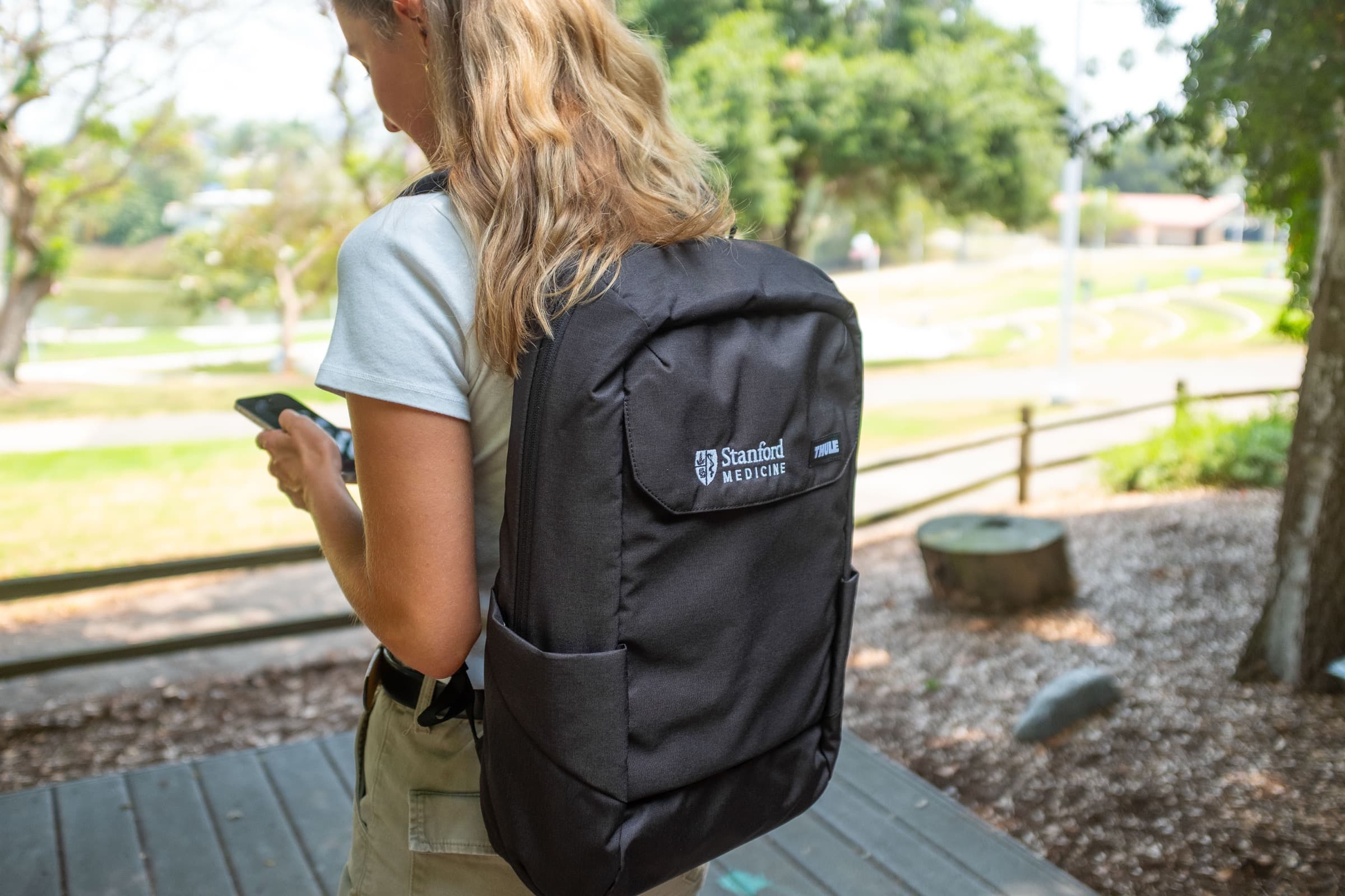 Person wearing a Stanford Medicine backpack outdoors