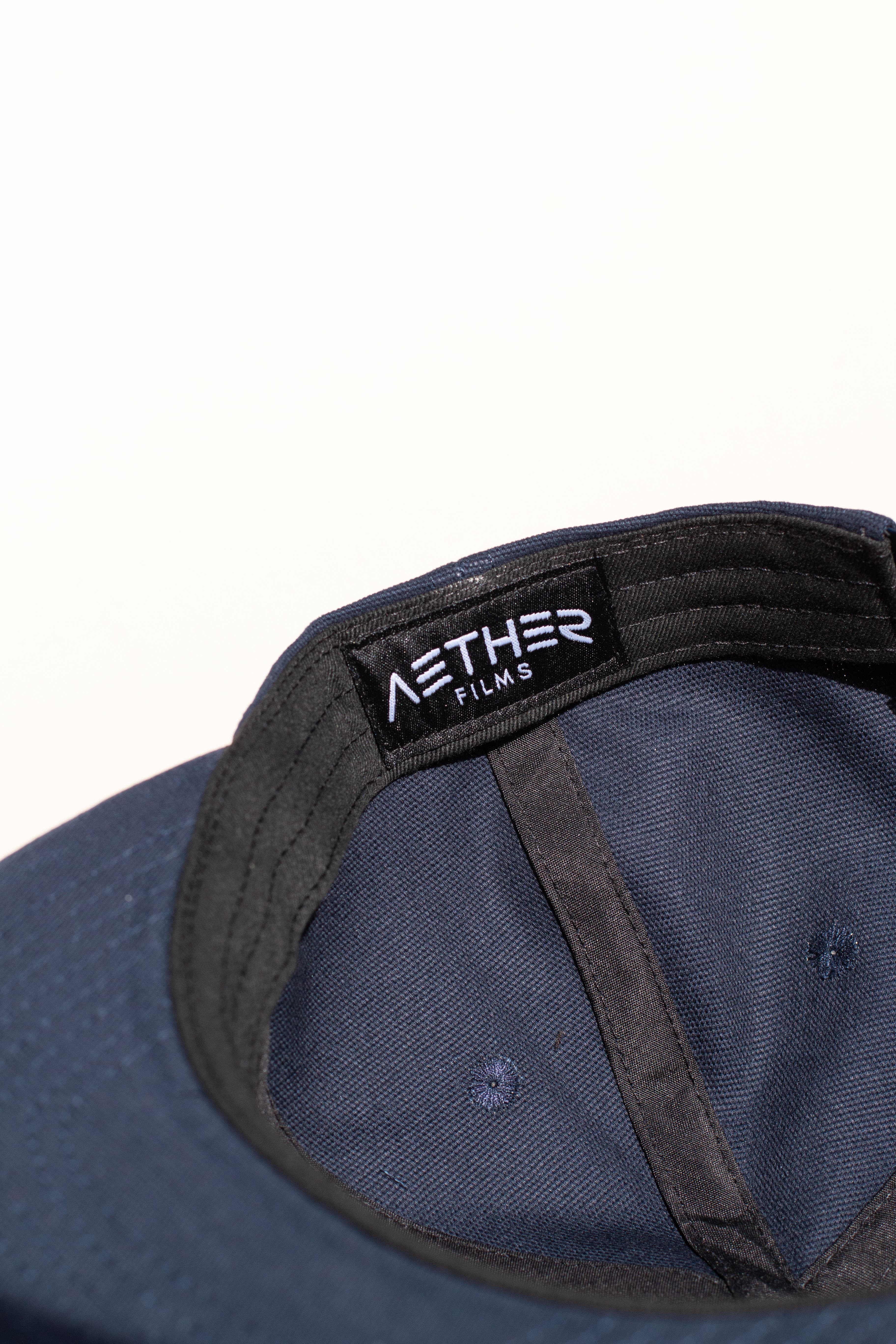 Interior woven label sewn into a custom hat