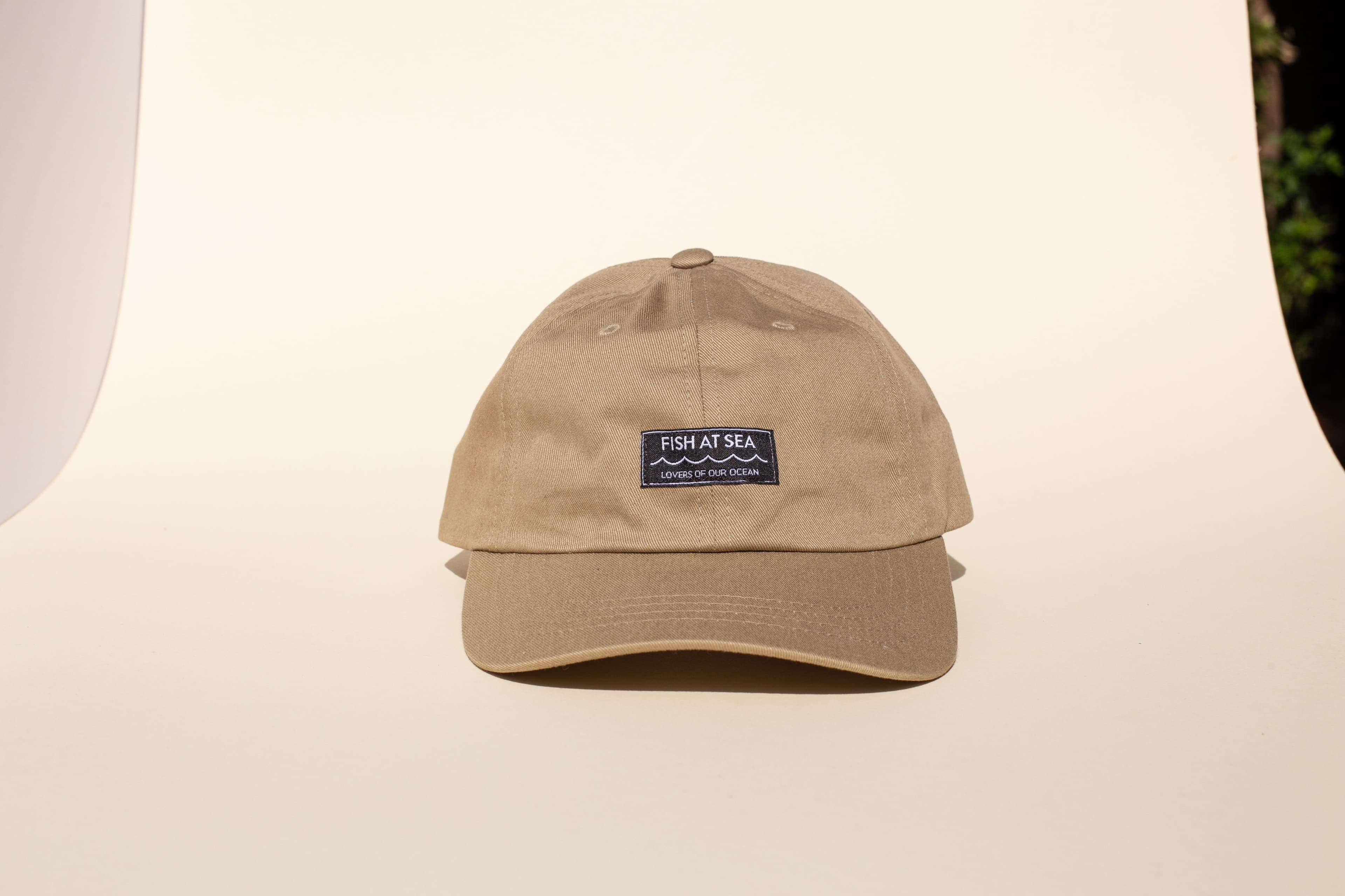 Woven label detail sewn into a hat