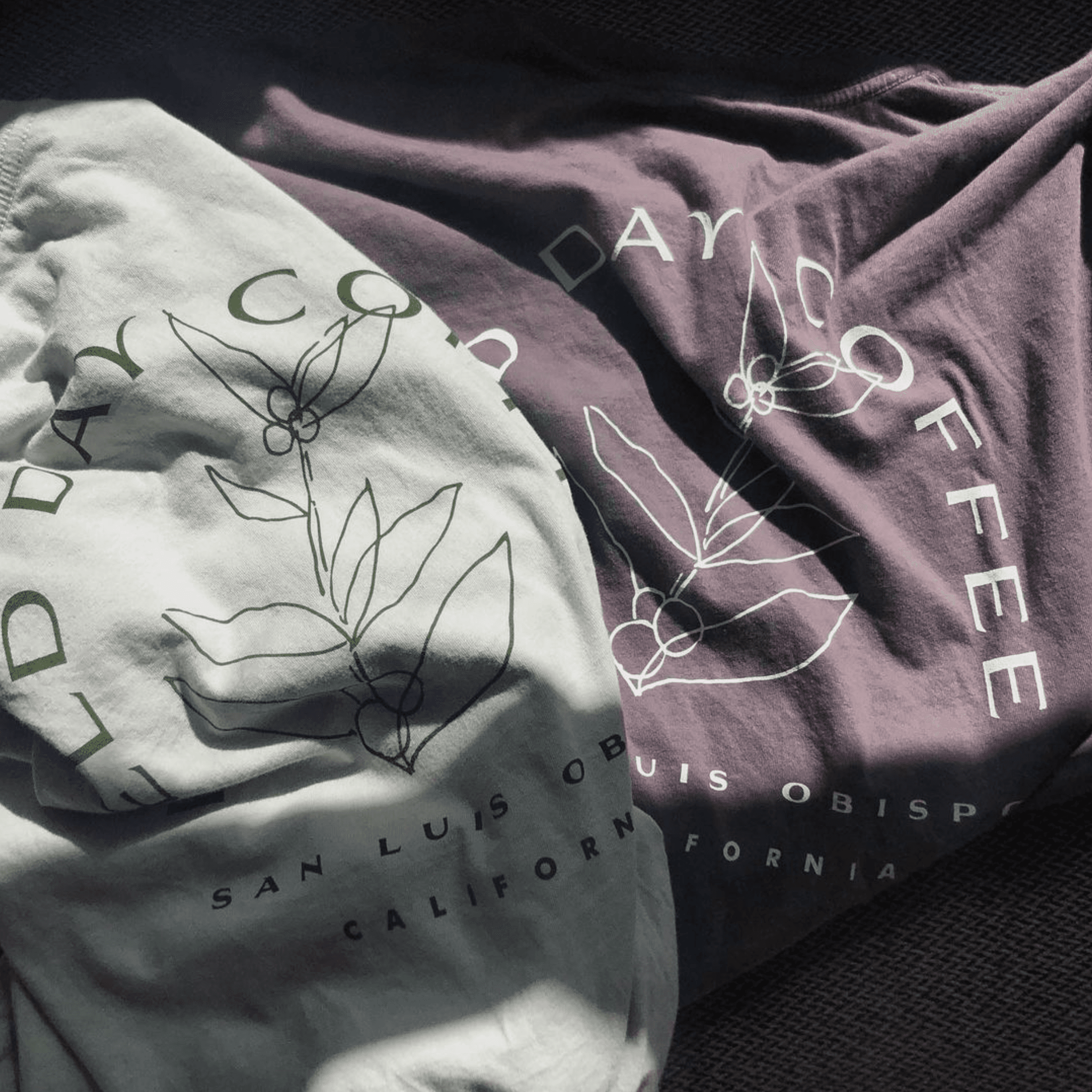 Graphic merch tees laid out side by side