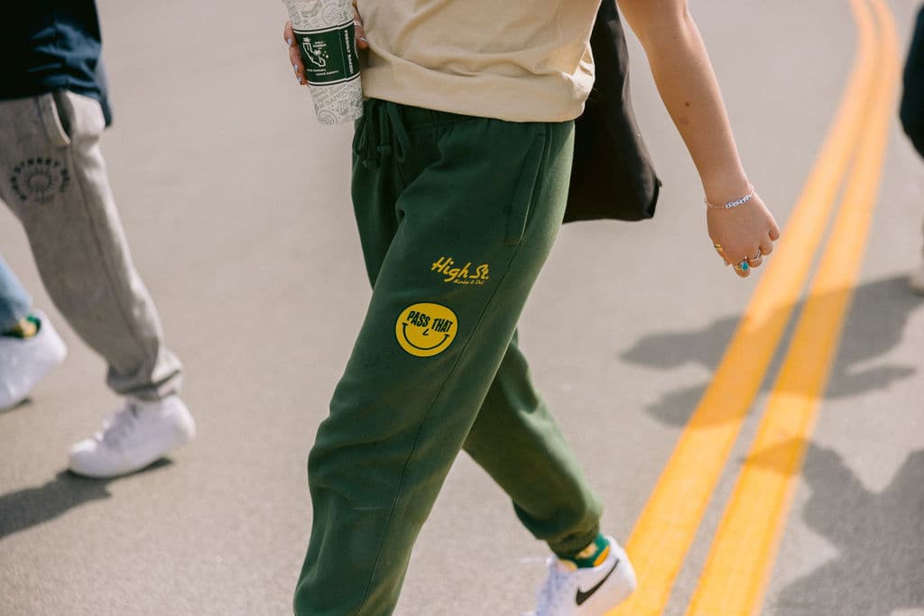 Printed green sweatpants shown as a custom apparel option