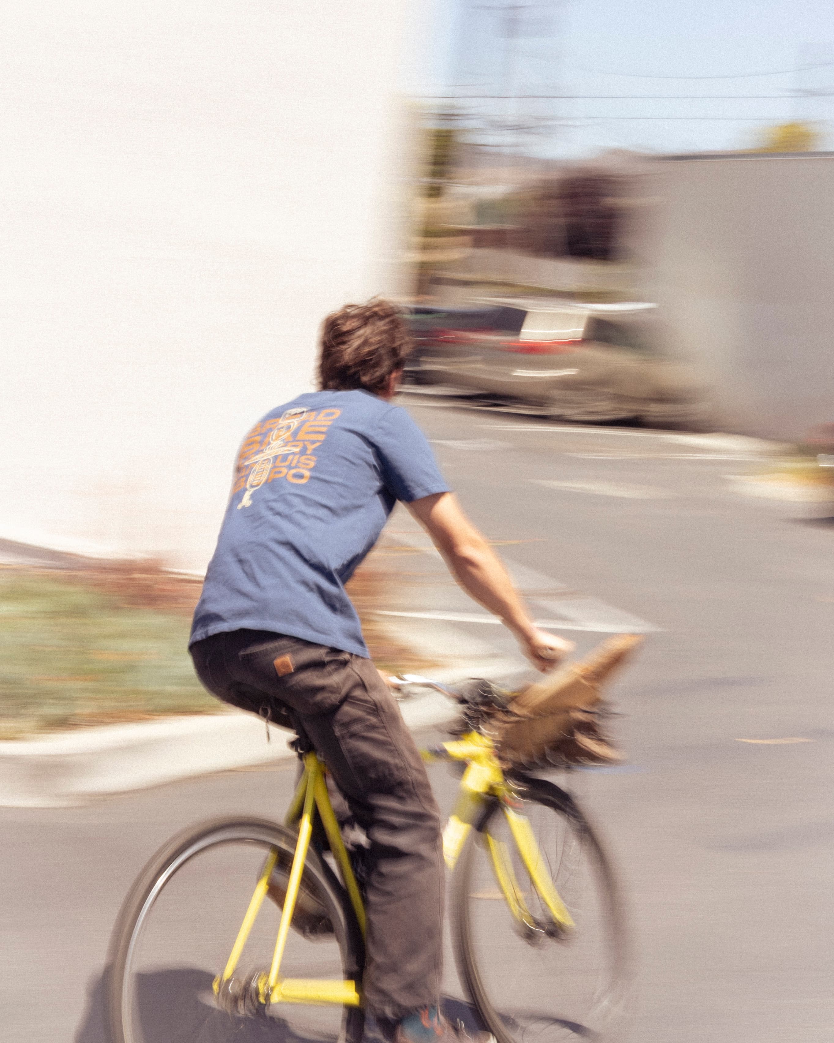Cyclist wearing a screen printed merch-drop tee