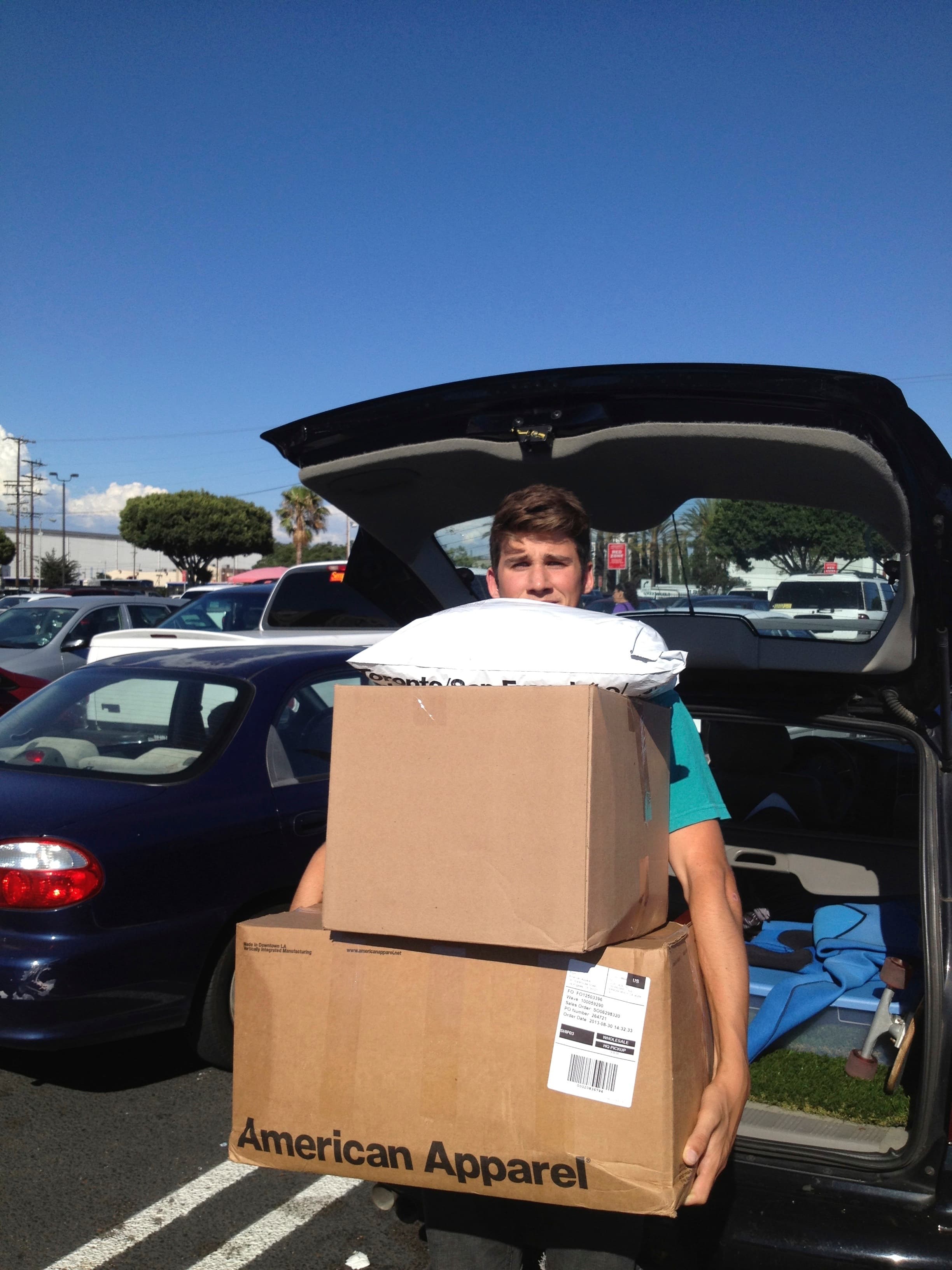 Easton carrying boxes from an early Fish At Sea order pickup