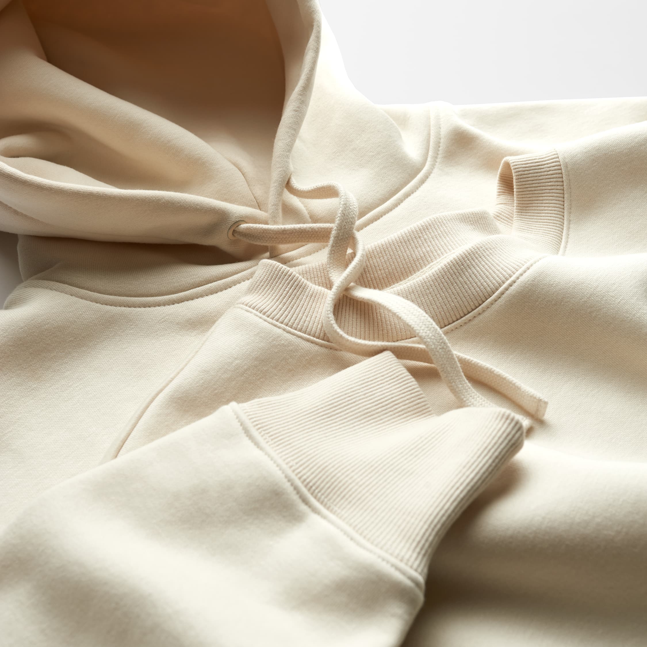 Close-up of an ecru heavyweight hoodie